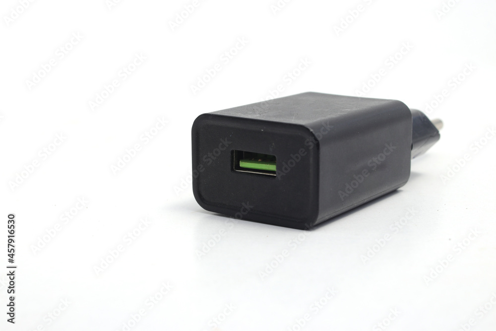 Black Cell Phone Charger Adapter with a green micro USB quick charge on hand isolated on white background Black Cell Phone Charger Adapter with a green micro USB quick charge on hand isolated on white background