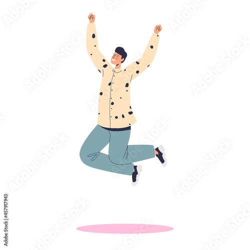 Excited joyful man jumping up with happy overjoyed smile. Happy male student or teenager cheering