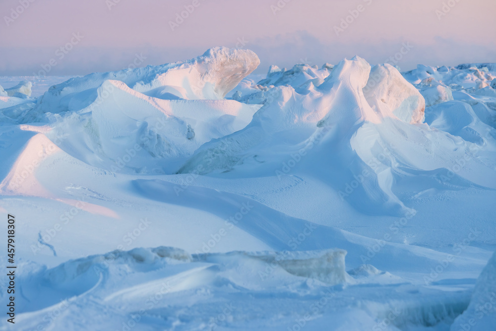 Winter arctic landscape. View of snow and ice at sunset. Ice hummocks ...