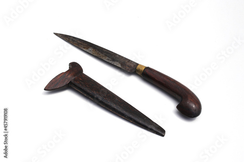 Old used Indonesian Knife with handle and knife scabbard made from wooden isolated on white background
