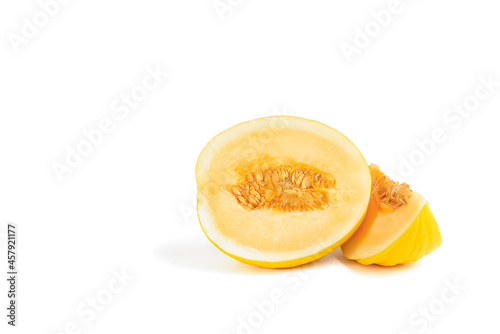 Melon on a white background. Yellow melon on a white isolate. Fresh juicy piece of melon with shadow on a white background. For insertion into a project, design or advertisement