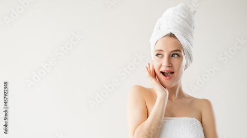 Anti-aged treatment. Amazed woman. Rejuvenation cosmetology. Advertising background. Pretty lady covering in towel posing isolated white copy space.