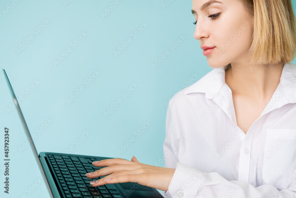 Business courses. Elegant woman. Investigation research. Study education. Concentrated lady typing laptop holding on hand isolated blue. Business courses. Elegant woman. Investigation research. Study education. Concentrated lady typing laptop holding on hand isolated blue.