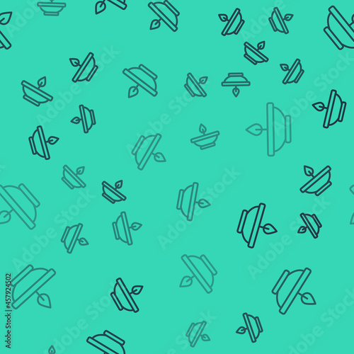Black line Aroma lamp icon isolated seamless pattern on green background. Vector