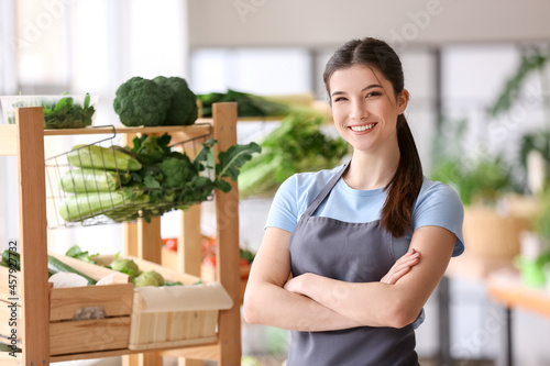 Female seller with fresh ve...