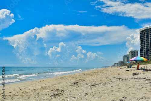 Sunny day on Hutchinson Island, Florida with cumulonimbus clouds forming