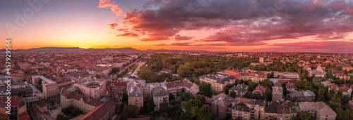 Aerial dramatic sunset view of the great city park Varosliget in Budapest with newly built playgrounds
