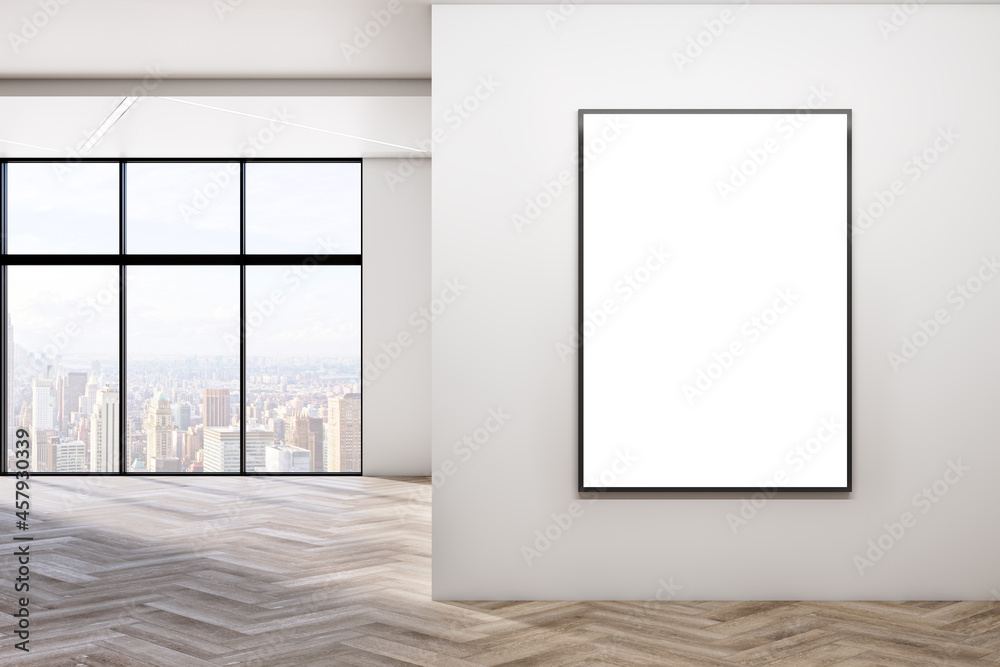 Modern empty concrete room interior with blank mock up poster on wall, windows, city view, sunlight, wooden flooring and shadows. 3D Rendering. Modern empty concrete room interior with blank mock up poster on wall, windows, city view, sunlight, wooden flooring and shadows. 3D Rendering.
