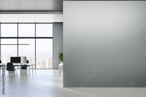 Modern concrete office interior with blank mock up place on wall, windows, city view, sunlight, equipment and furniture. 3D Rendering.