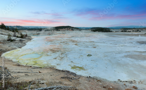 Overview of Norris Geyser Basin at sunset at Yellowstone National Park, Wyoming USA. Norris Geyser Basin is one of the Geothermal areas of Yellowstone.
