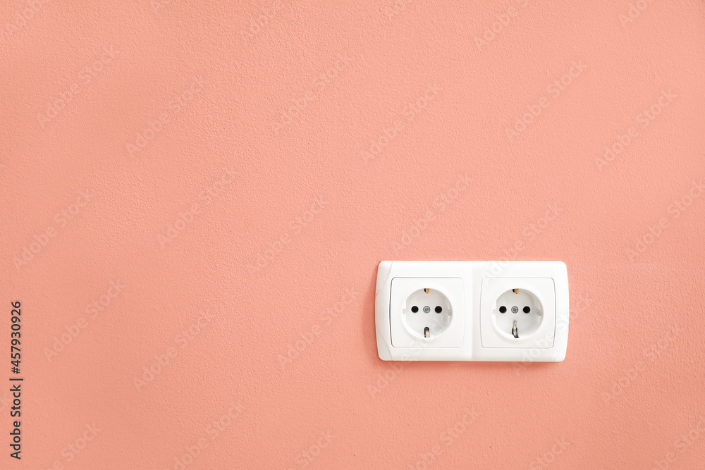 Electric socket on color wall Electric socket on color wall