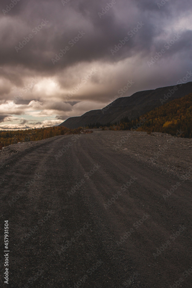 The road goes into the distance to the mountains 