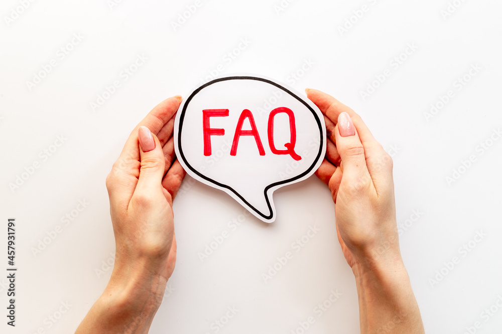 Hands with faq word on paper bubble. Frequently asked questions concept Hands with faq word on paper bubble. Frequently asked questions concept