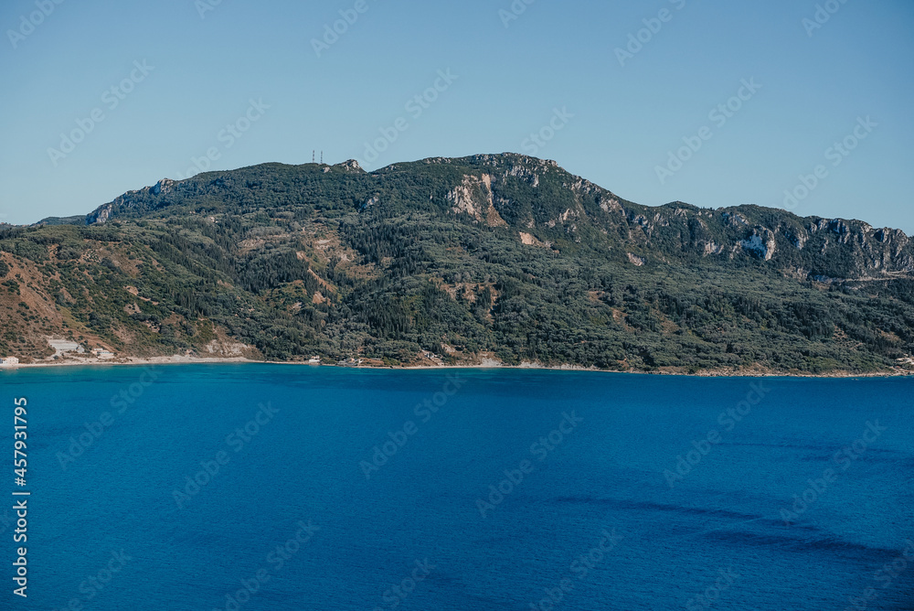 View to seascape with clear azure crystal water. Amazing blue Mediterranean background. Travel destination, universal nature, resort, summer Greece island vacation. 