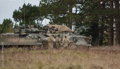British army Warrior FV510 light infantry fighting vehicle and FV432 Bulldog on a military exercise Salisbury Plain, Wiltshire UK