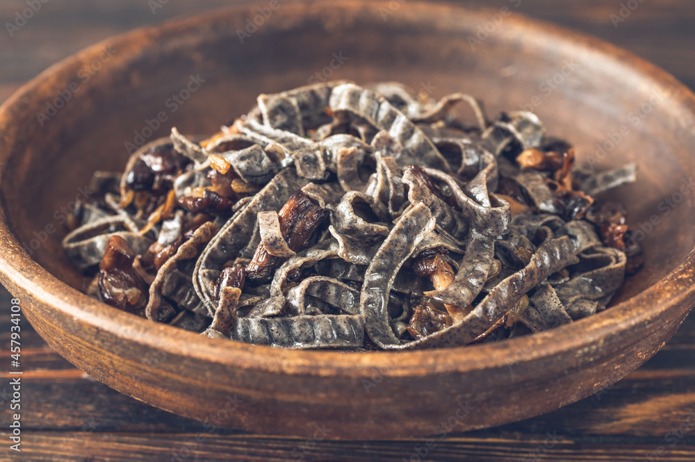 Bowl of black noodles with mushrooms Bowl of black noodles with mushrooms