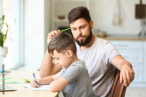 Father and son learning tog...