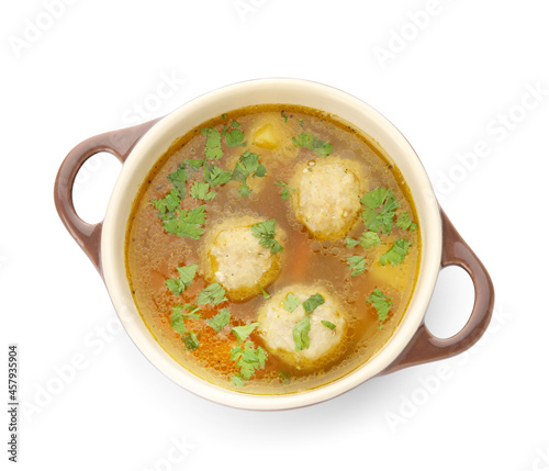 Cooking pot with tasty meatball soup on white background