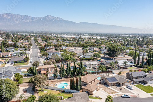 Aerial view of suburban home with swimming pool photo