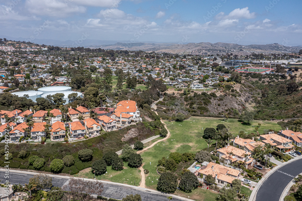 Aerial View of Condos overlooking a golf course in an upscale neighborhood