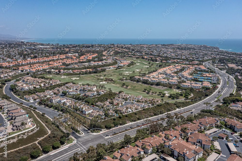 Upscale California oceanfront neighborhood, aerial view of golf course, ocean, and master planned community