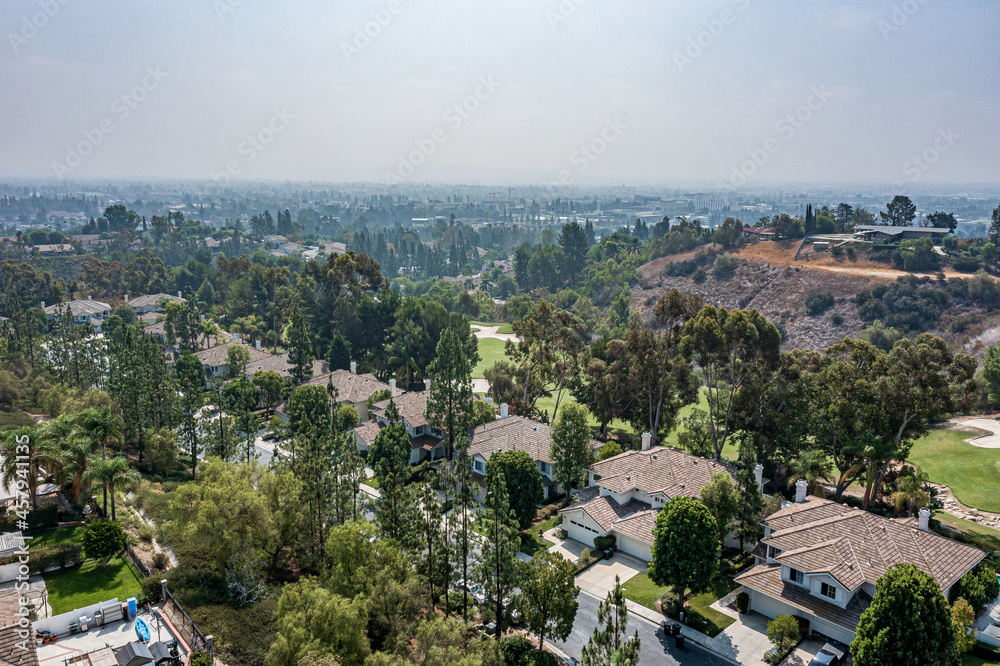Aerial View of a Suburban California Community Near a Golf Course on a Foggy Day
