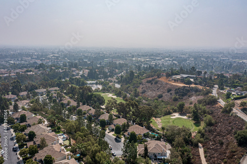 Aerial View of a Suburban California Community Near a Golf Course on a Foggy Day