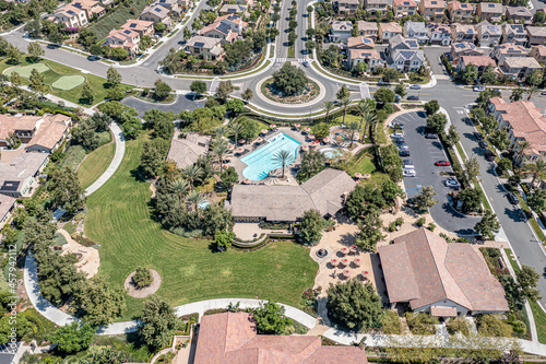 Aerial view of roundabout, pool, park, and clubhouse for a master planned community in Southern California. photo