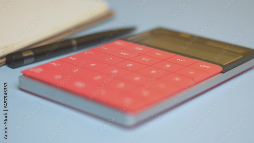 Calculator and notepad on desk. Working space. Close-up view of accountant work desktop Calculator and notepad on desk. Working space. Close-up view of accountant work desktop
