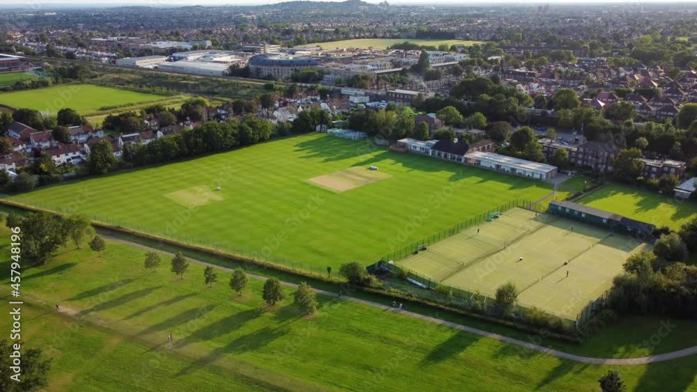 Aerial shot flying over an urban town and recreational sports ground in Britain Aerial shot flying over an urban town and recreational sports ground in Britain