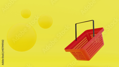 3D render. A red plastic supermarket basket with a black handle on the right and on the left 3 yellow spheres on a yellow background.