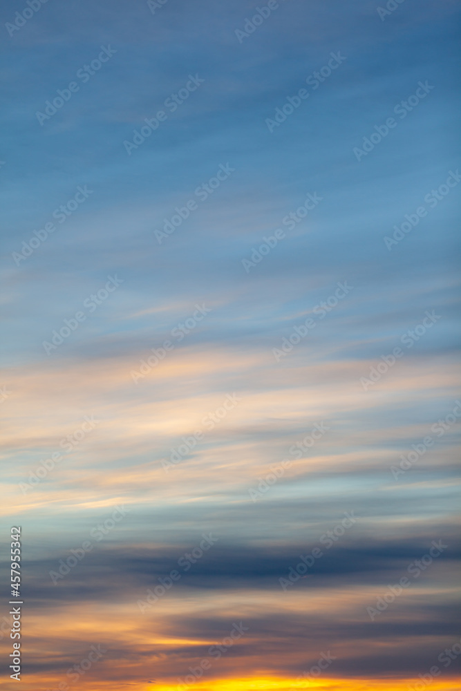 Fototapeta premium Colorful sunset or sunrise in the sky. The sky and clouds are painted in different delicate colors.