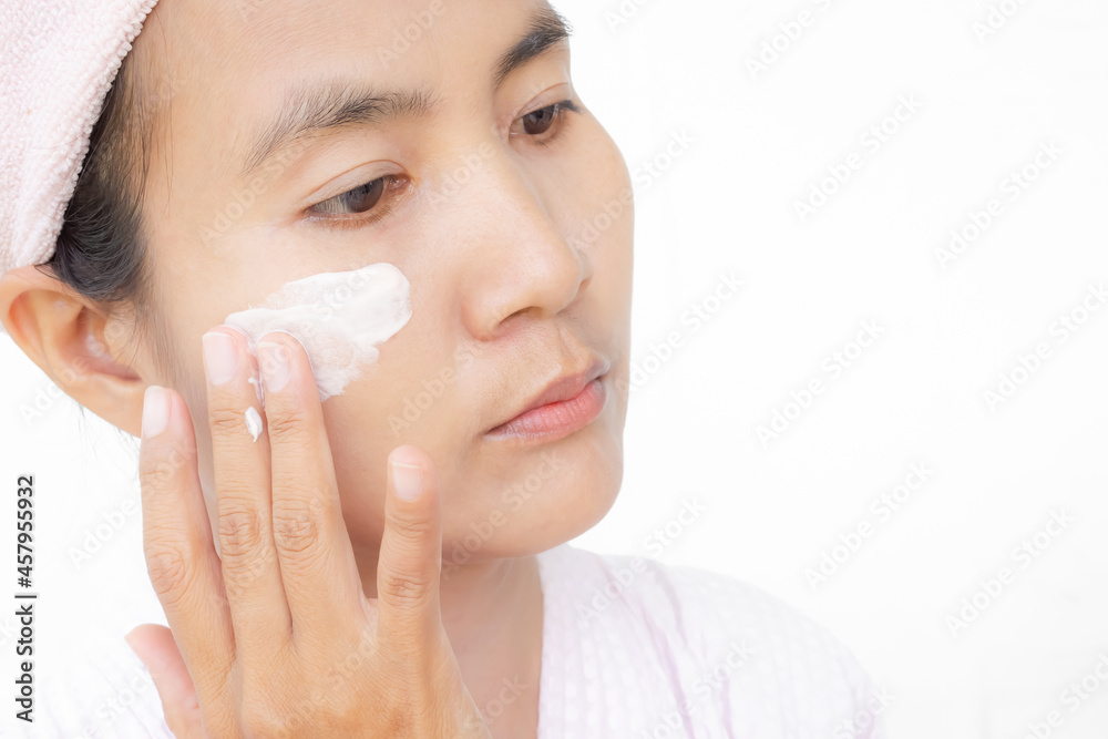 Woman applying lotion skin serum cream on face after shower. Moisturizer skin care for moisturized reduce wrinkles and protection UV A, B. cosmetic for beauty and good health concept. Woman applying lotion skin serum cream on face after shower. Moisturizer skin care for moisturized reduce wrinkles and protection UV A, B. cosmetic for beauty and good health concept.
