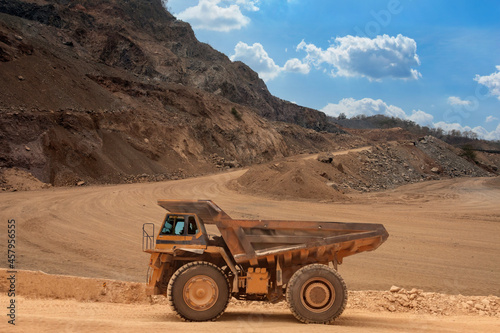 Mining truck for loading limestone moving on road career.open pit mine industry.