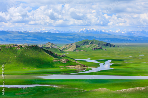 Bayinbuluke grassland natural scenery in Xinjiang,China.Beautiful grassland and mountain landscape. photo