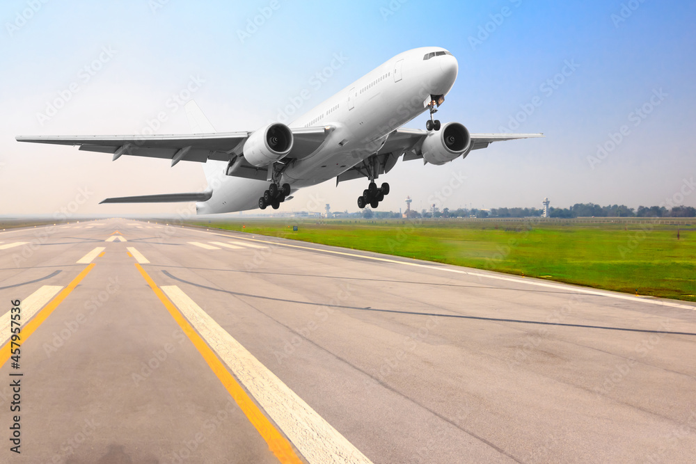 Passenger airplane landing on runway in airport