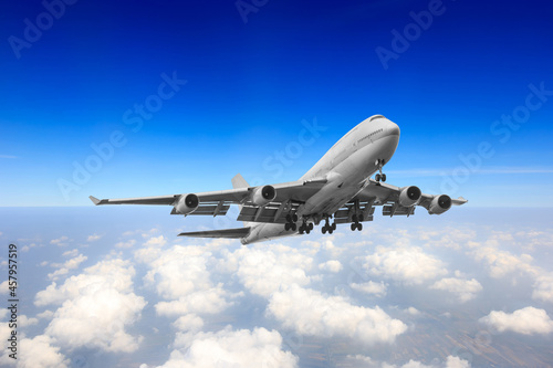 Fototapeta Naklejka Na Ścianę i Meble -  Passenger aircraft flying high above the clouds prepared landed at the runway