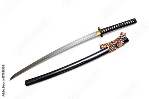Canvastavla Japanese sword steel fitting and colorful cord with black scabbard isolated in white background