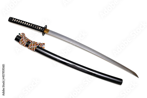 Japanese sword steel fitting and colorful cord with black scabbard isolated in white background. Selective focus.