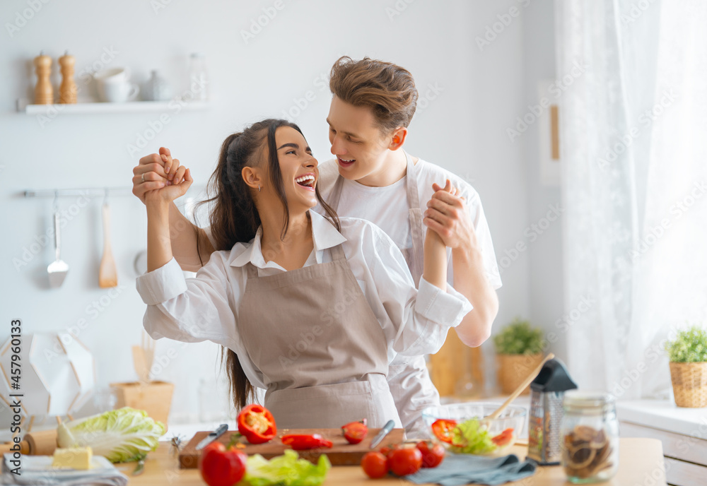 loving couple is preparing the proper meal loving couple is preparing the proper meal