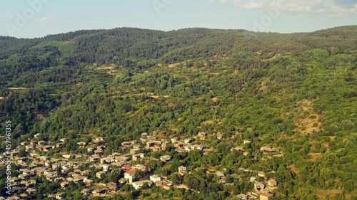 Aerial flight over historical old mountain village houses of Kovachevitsa Rhodopes Bulgaria photo