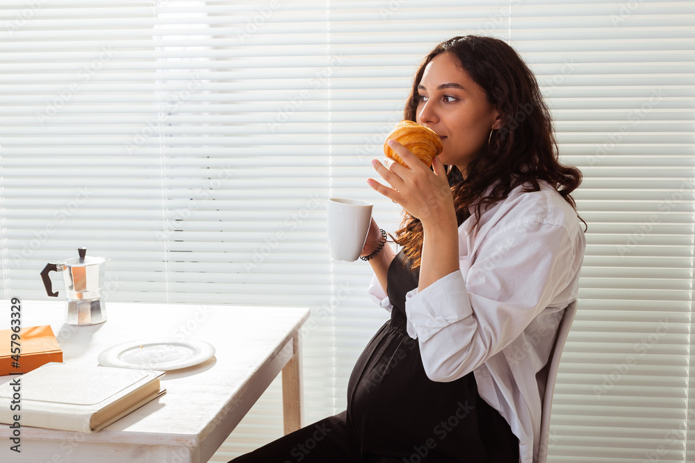 Pregnant woman eating breakfast. Pregnancy and maternity leave