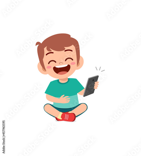 little boy using mobile phone and laugh