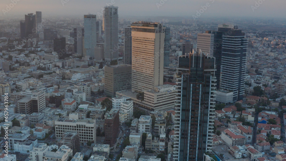 Tel aviv Skyscrapers cityscape panorama at Sunset, Aerial view
drone view from Tel aviv at sunset with coastline
