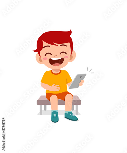 little boy using mobile phone and laugh