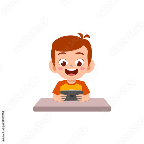 little boy using mobile phone and laugh