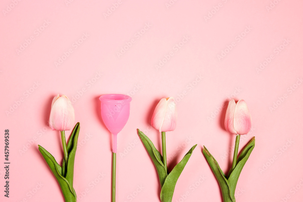 Tulips with menstrual cup as a flower on pink background. Eco-friendly reusable silicone, ecological alternative, zero waste concept. - obrazy, fototapety, plakaty 