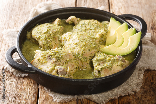 Jocon Guatemalan Chicken stew in Green Sauce close up in the plate on the table. Horizontal photo