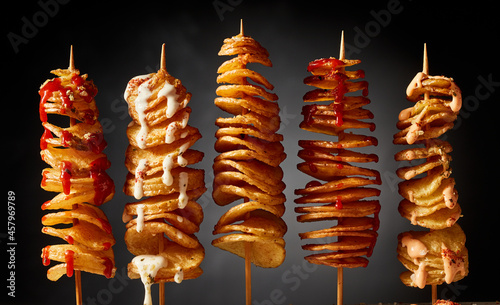 Yummy fried potatoes on skewers