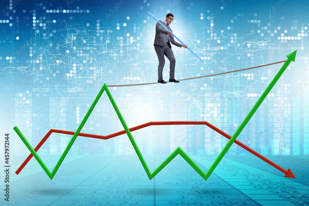 Businessman balancing on tightrope on line chart Businessman balancing on tightrope on line chart